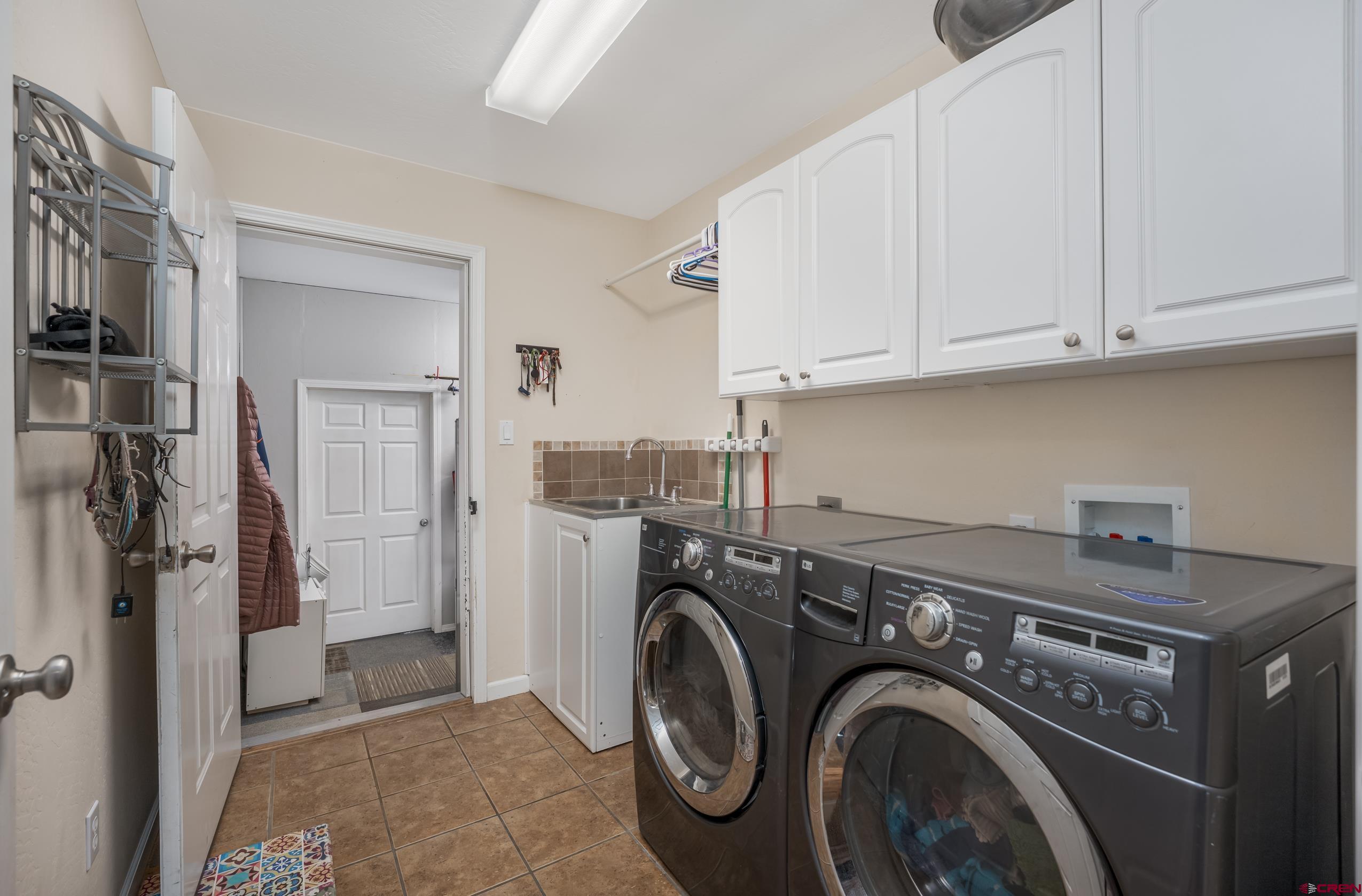 517 Dove Ranch Road Bayfield, CO 81122 - Photo 14 of 29 a utility room with dryer and washer