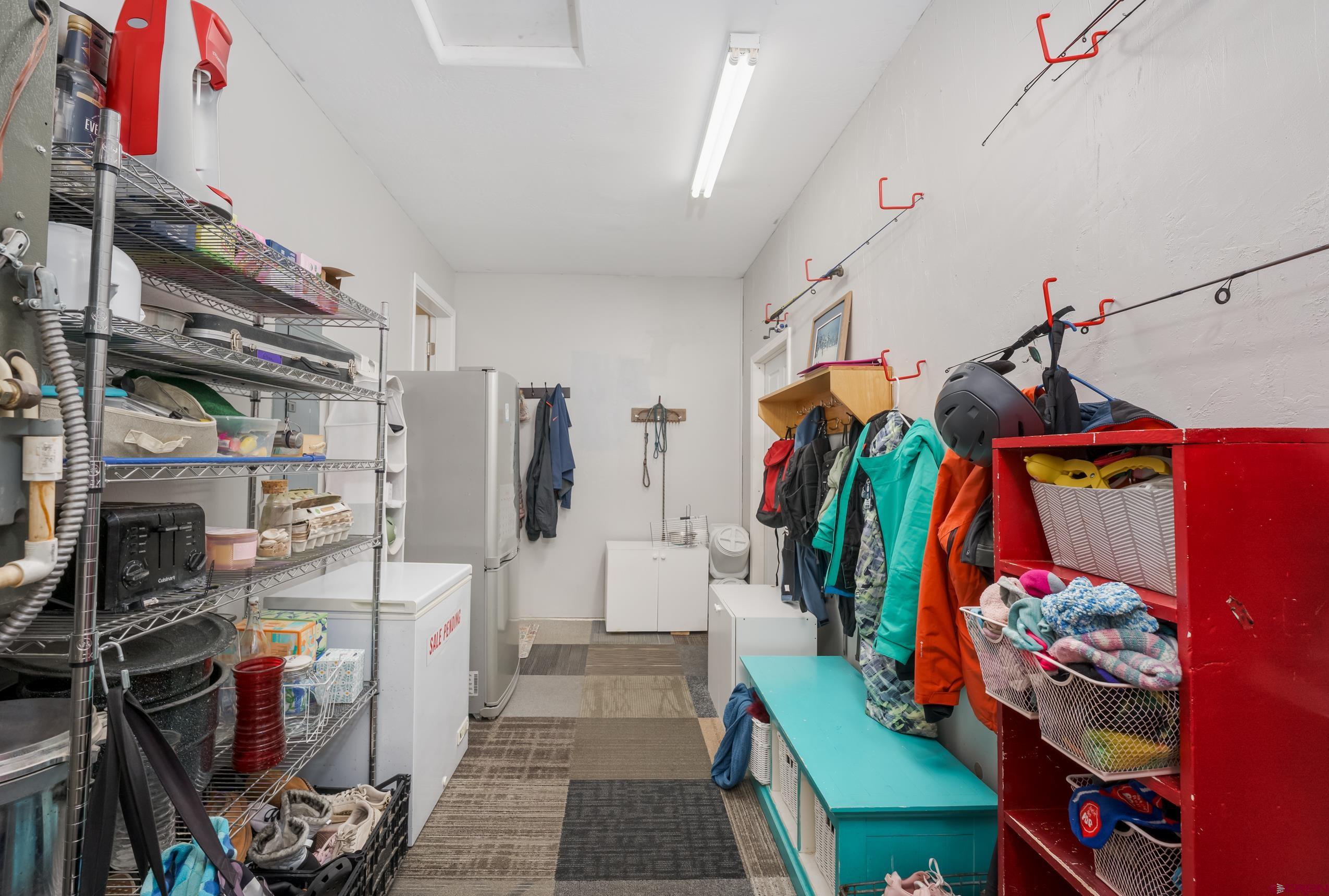 517 Dove Ranch Road Bayfield, CO 81122 - Photo 15 of 29 a view of walk in closet with clothes and shoes