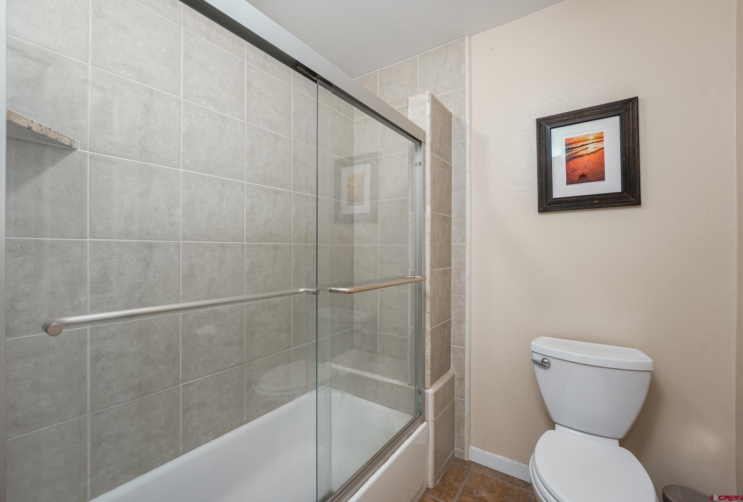 517 Dove Ranch Road Bayfield, CO 81122 - Photo 19 of 29 a bathroom with a toilet and a shower