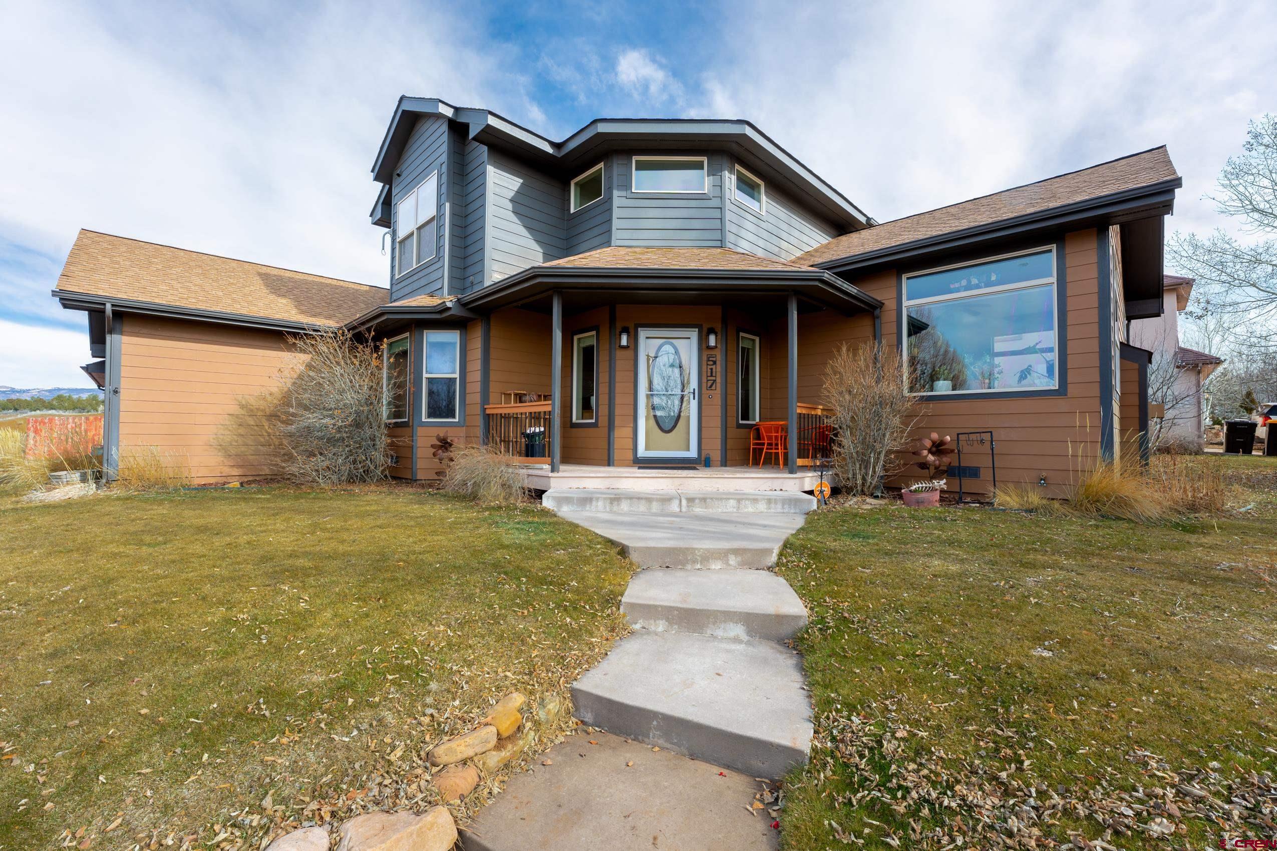 517 Dove Ranch Road Bayfield, CO 81122 - Photo 2 of 29 a front view of a house having patio