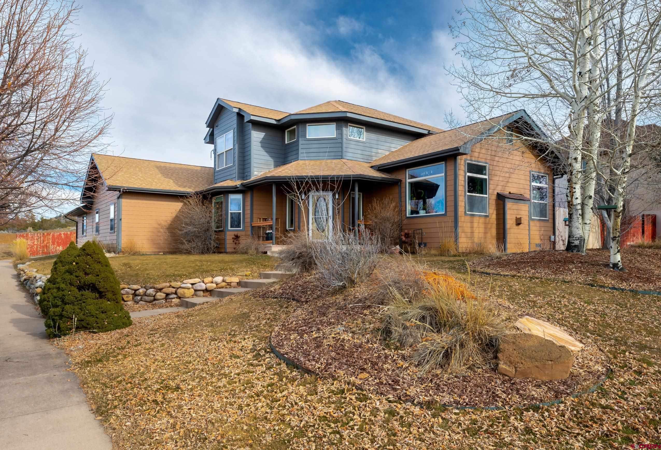 517 Dove Ranch Road Bayfield, CO 81122 - Photo 25 of 29 a front view of a house with garden
