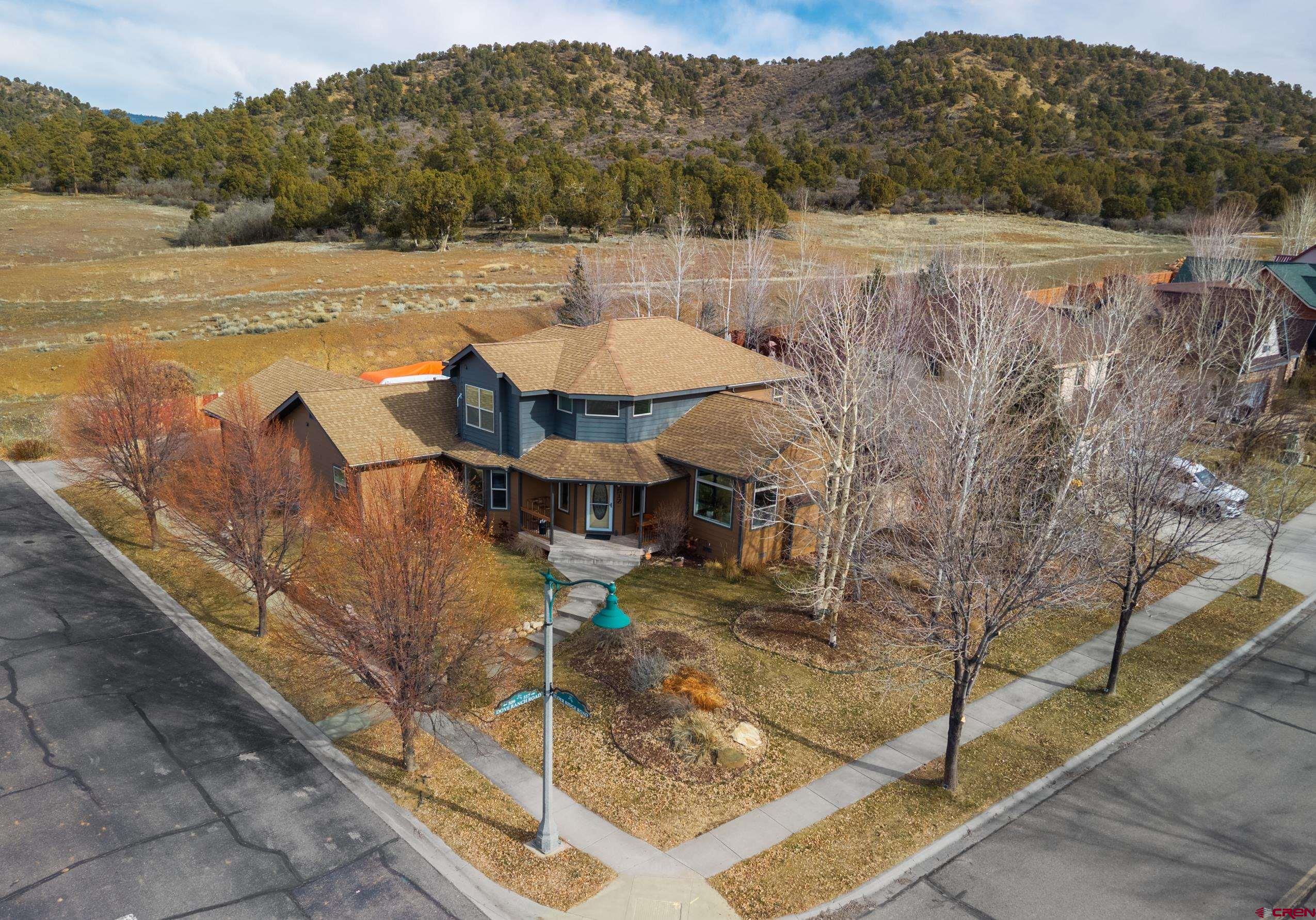 517 Dove Ranch Road Bayfield, CO 81122 - Photo 27 of 29 a view of a terrace with a table and chairs