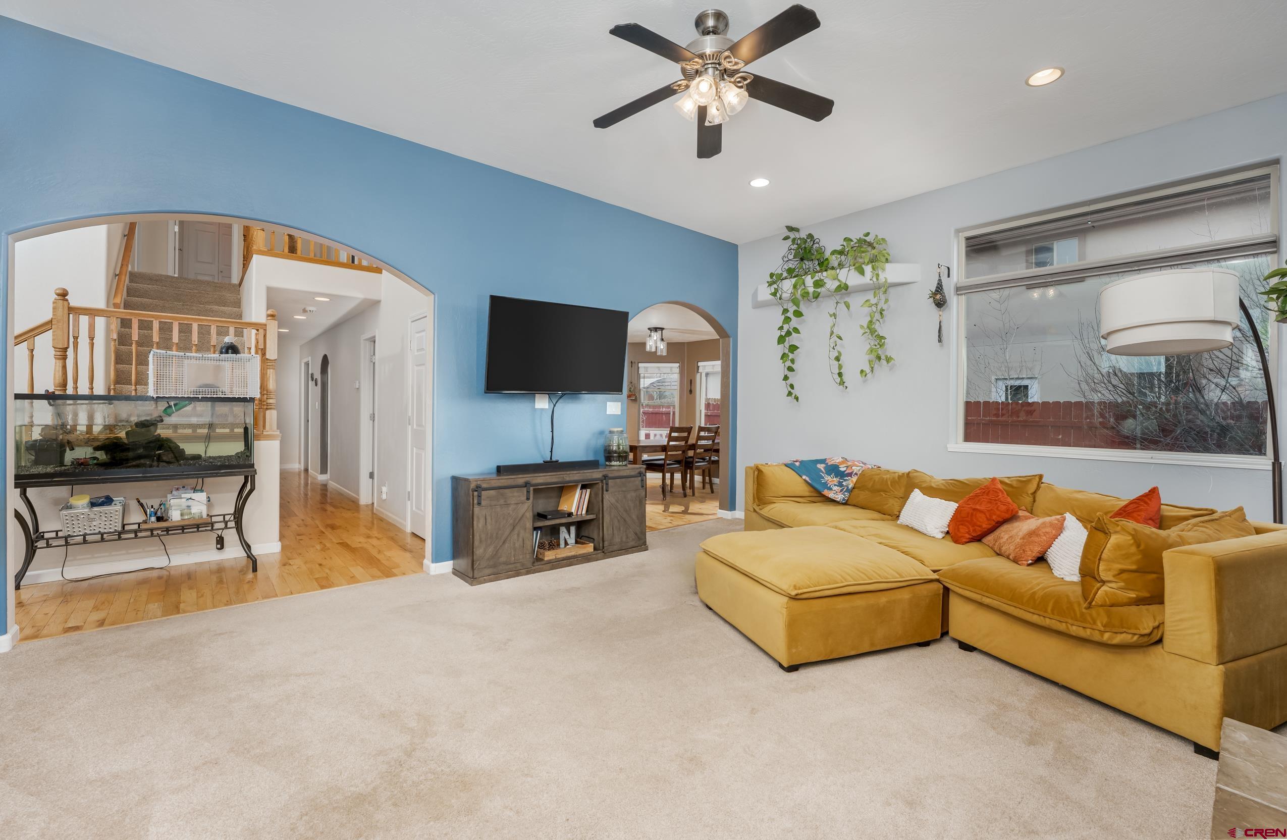 517 Dove Ranch Road Bayfield, CO 81122 - Photo 3 of 29 a living room with furniture and a flat screen tv