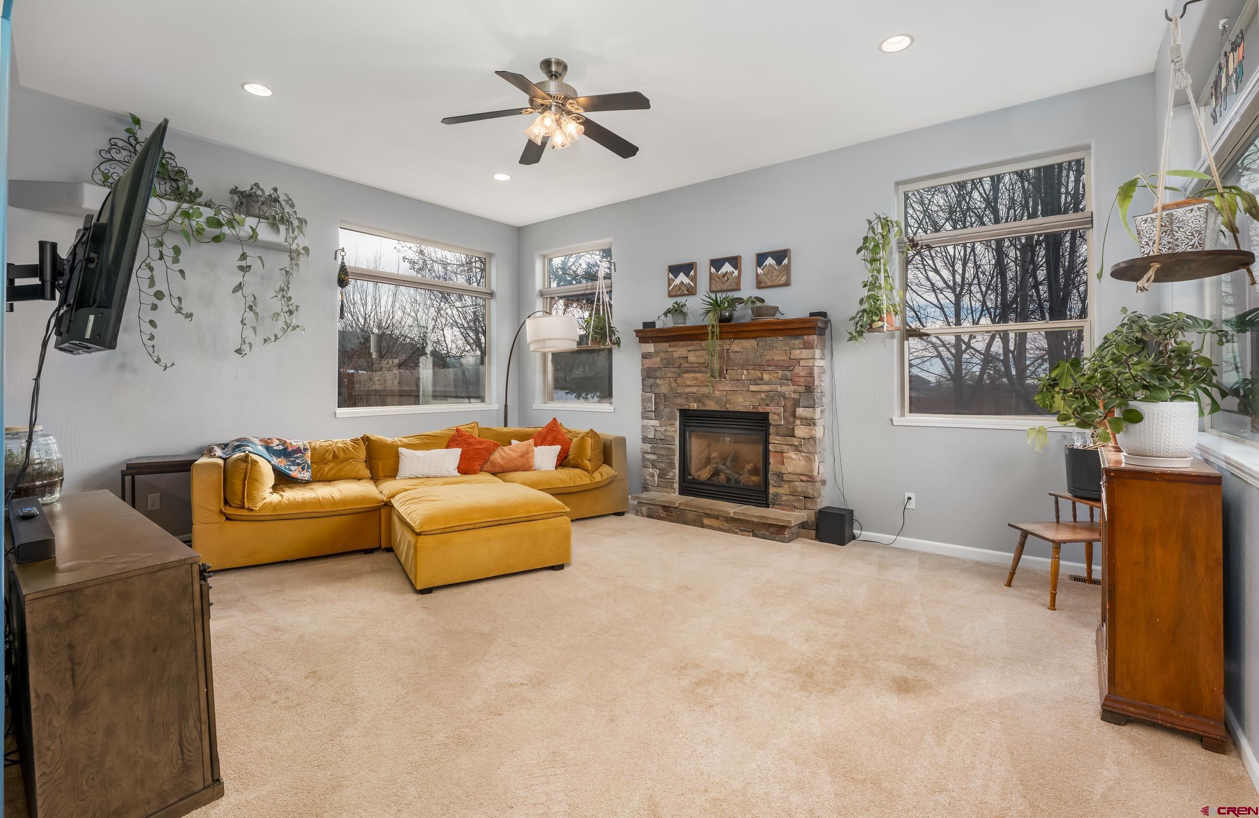 517 Dove Ranch Road Bayfield, CO 81122 - Photo 4 of 29 a living room with furniture and a fireplace