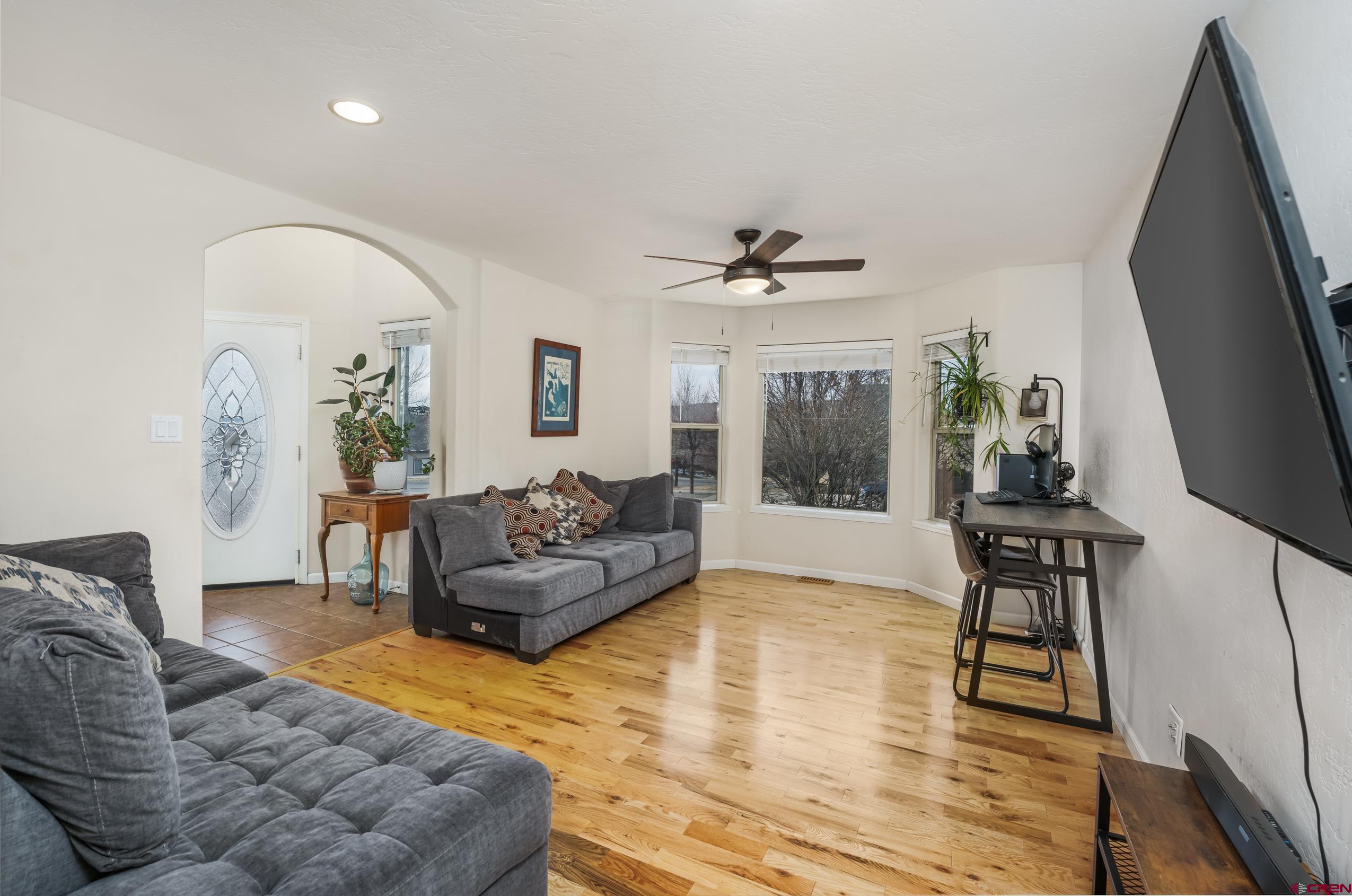 517 Dove Ranch Road Bayfield, CO 81122 - Photo 8 of 29 a living room with furniture and a flat screen tv