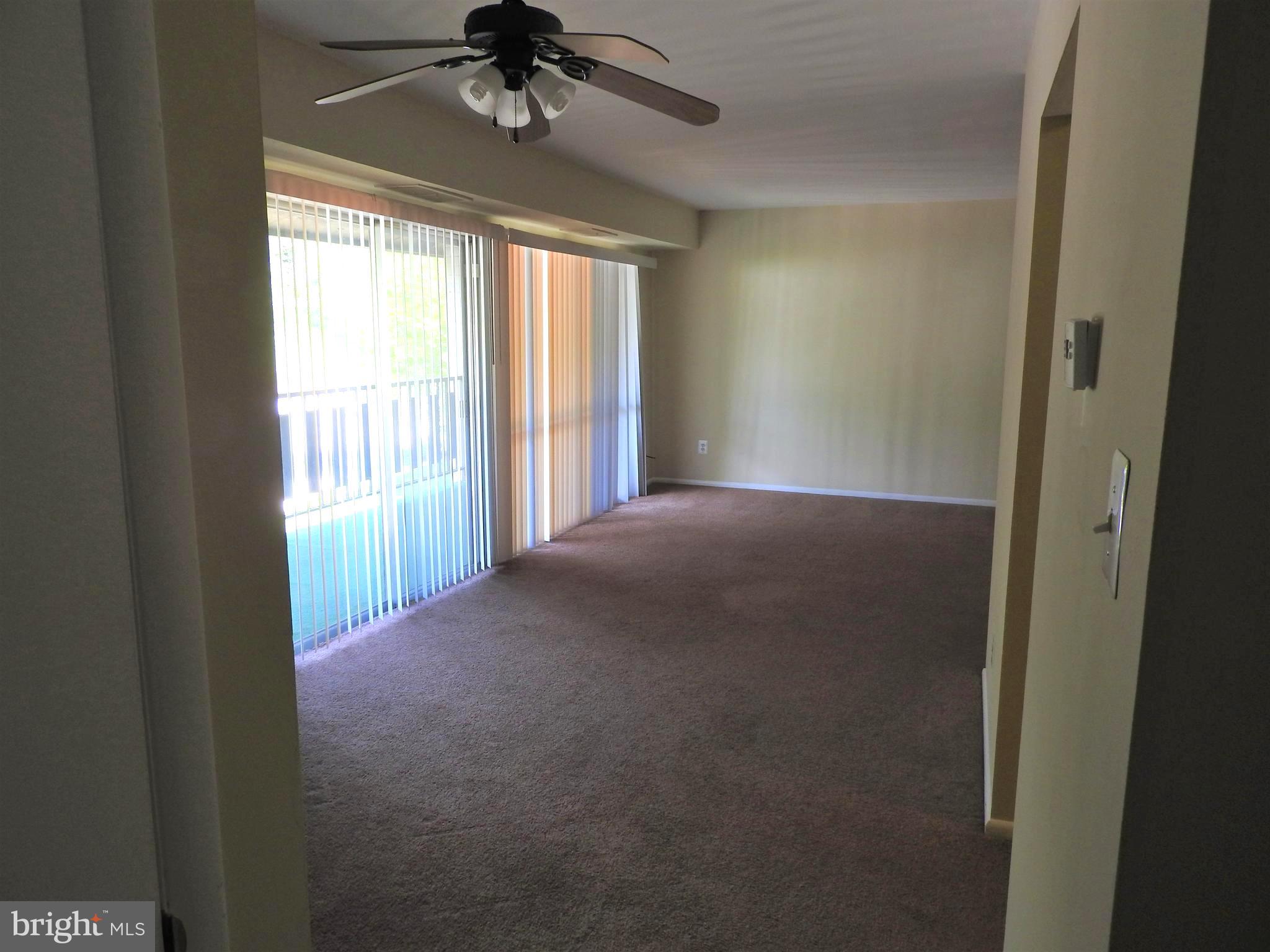 3120 Brinkley Road, Unit 3304 Temple Hills, MD 20748 - Photo 3 of 18 Living room/dining room combination.