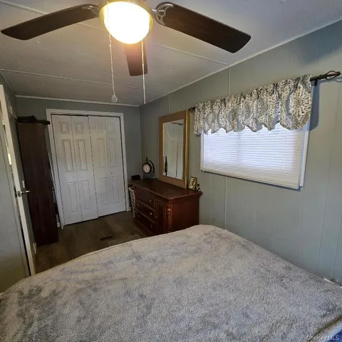 a bathroom with a sink a toilet and shower curtain