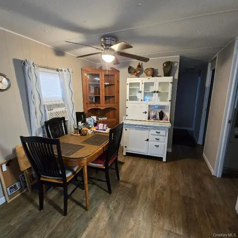 a dining room with furniture and window