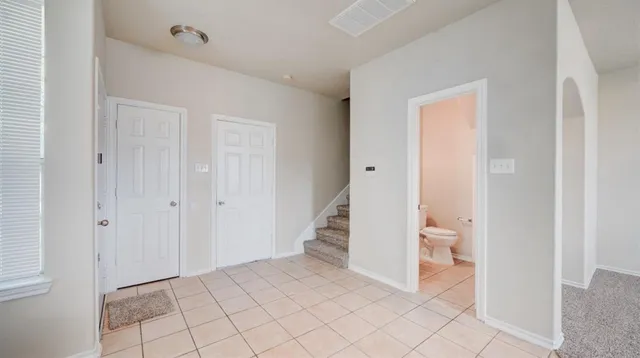 a view of a bathroom from a hallway