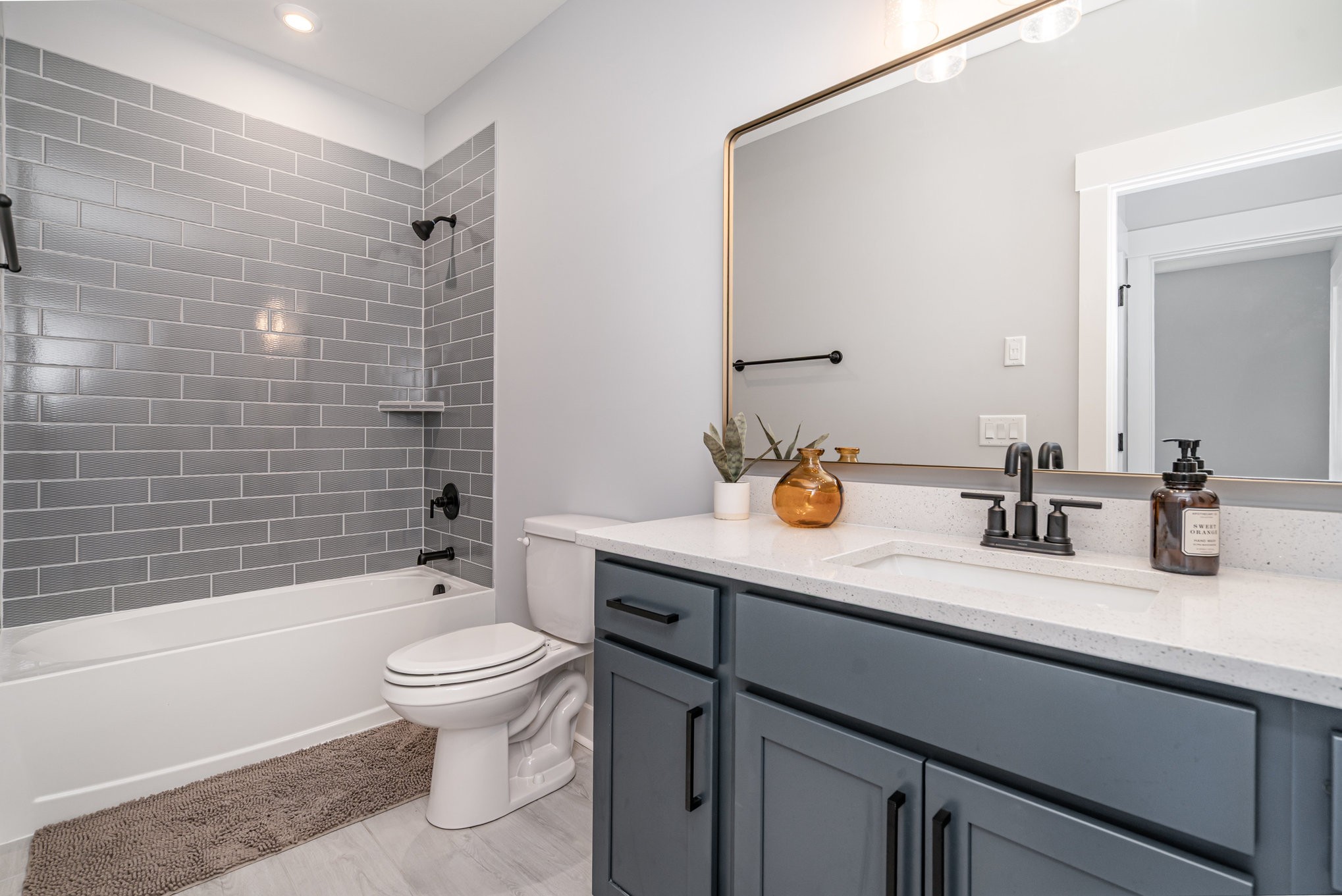 3427 Earhart Road Mount Juliet, TN 37122 - Photo 12 of 26 a bathroom with a sink a toilet and shower