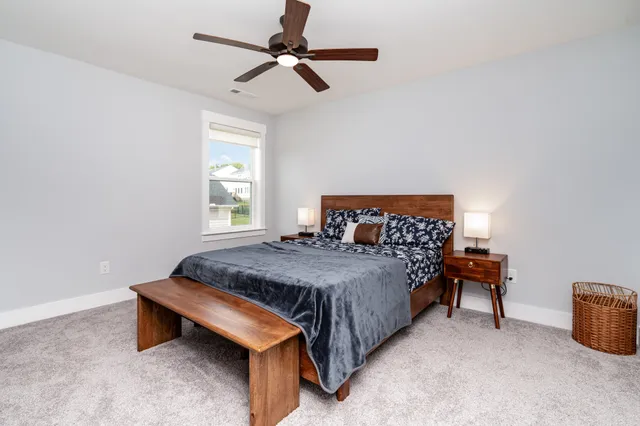 a bedroom with bed and window