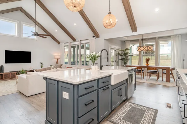 a bathroom with a sink a vanity and a large mirror