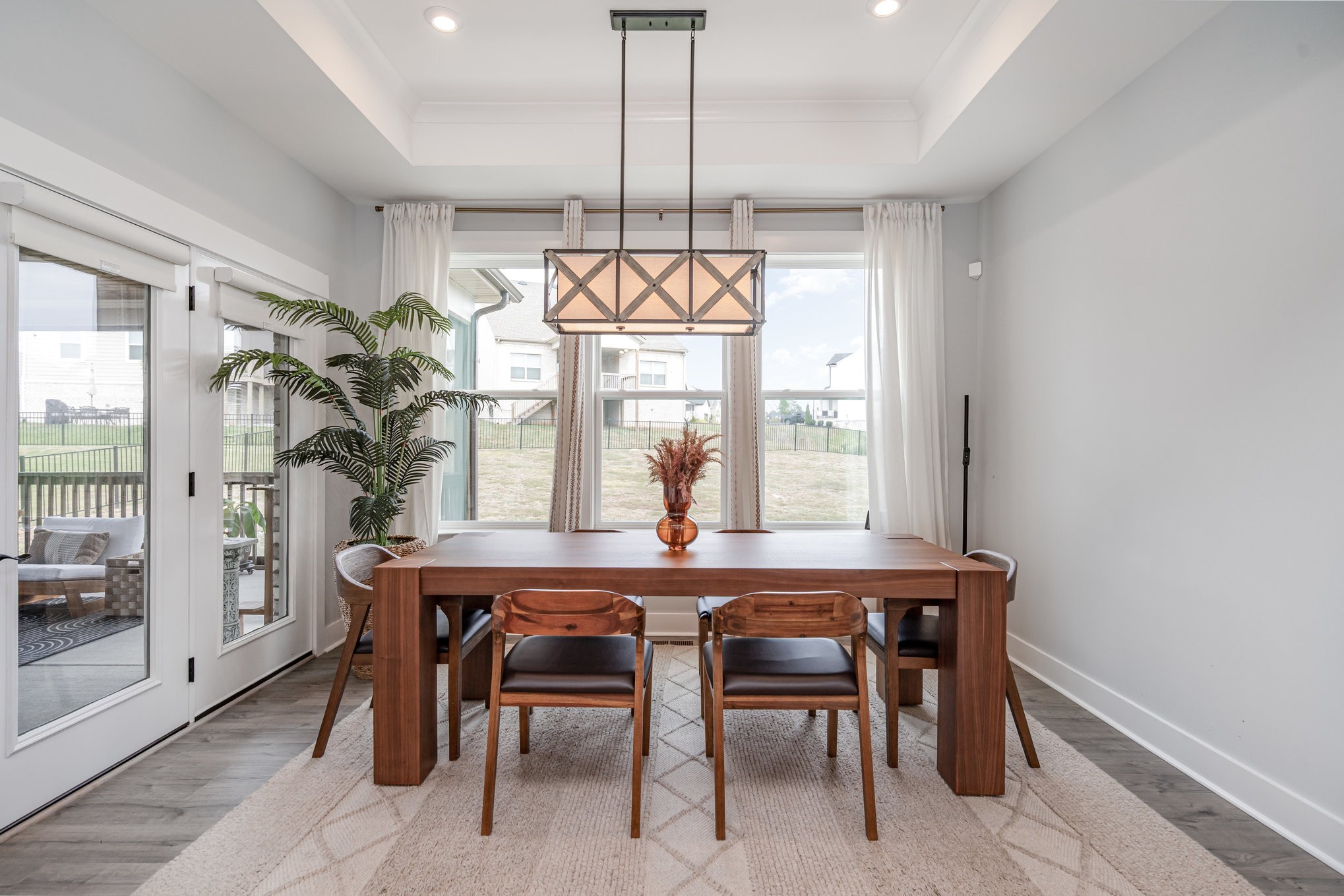 3427 Earhart Road Mount Juliet, TN 37122 - Photo 8 of 26 a dining room with furniture a chandelier and wooden floor