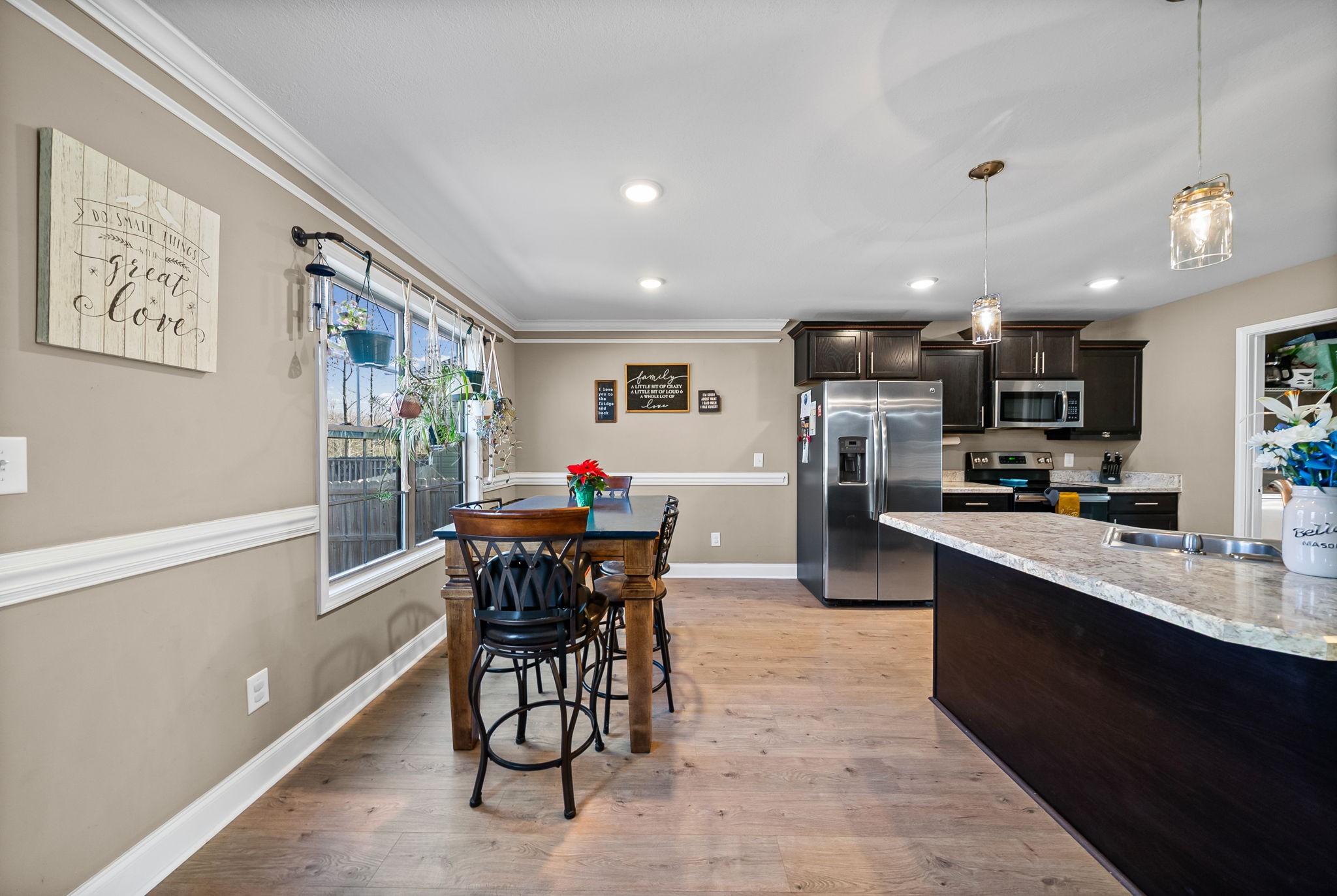 548 Medallion Circle Clarksville, TN 37042 - Photo 12 of 40 a view of a dining room with furniture and a kitchen