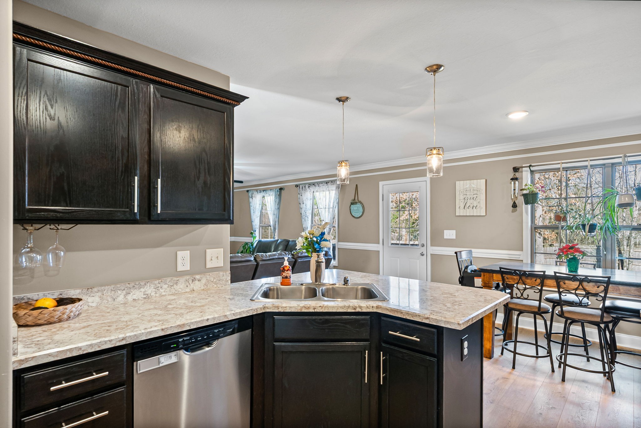 548 Medallion Circle Clarksville, TN 37042 - Photo 16 of 40 a kitchen with a sink and chairs