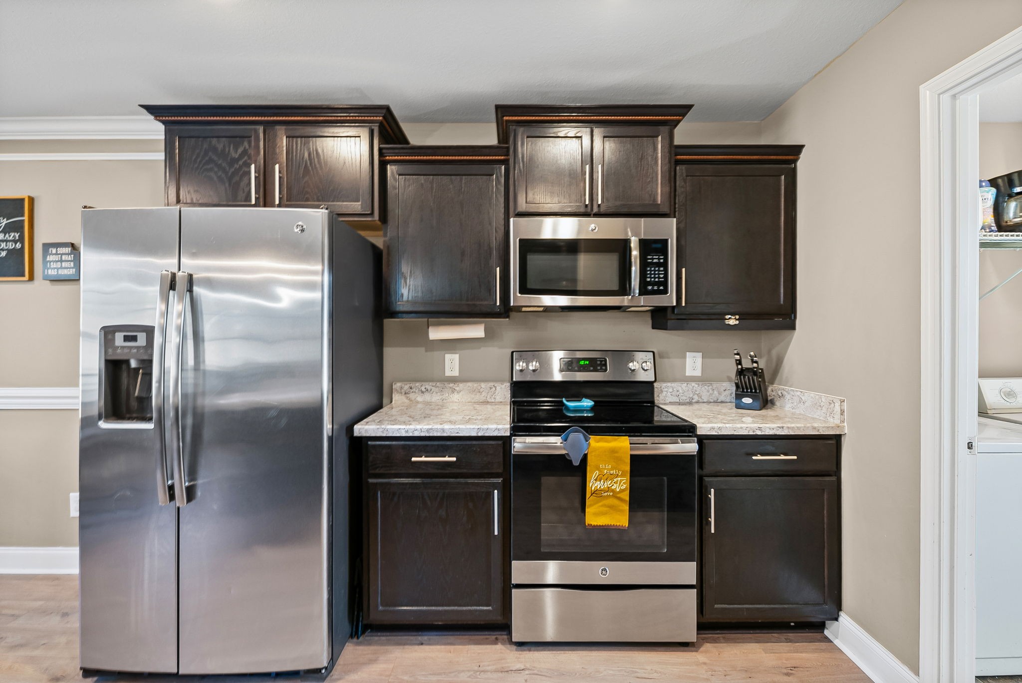 548 Medallion Circle Clarksville, TN 37042 - Photo 17 of 40 a kitchen with stainless steel appliances granite countertop a refrigerator a stove a sink and dishwasher