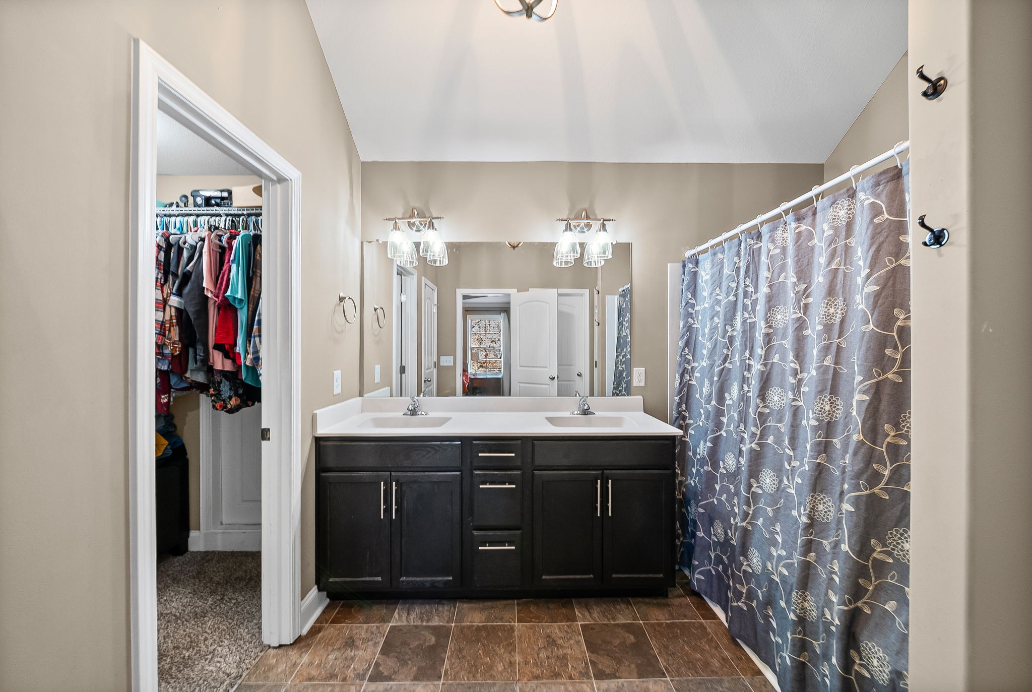 548 Medallion Circle Clarksville, TN 37042 - Photo 22 of 40 a bathroom with a granite countertop sink a mirror and a shower