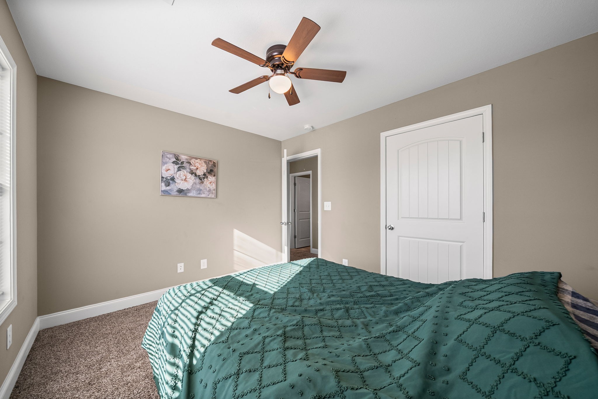 548 Medallion Circle Clarksville, TN 37042 - Photo 28 of 40 a bedroom with a large bed and a chandelier