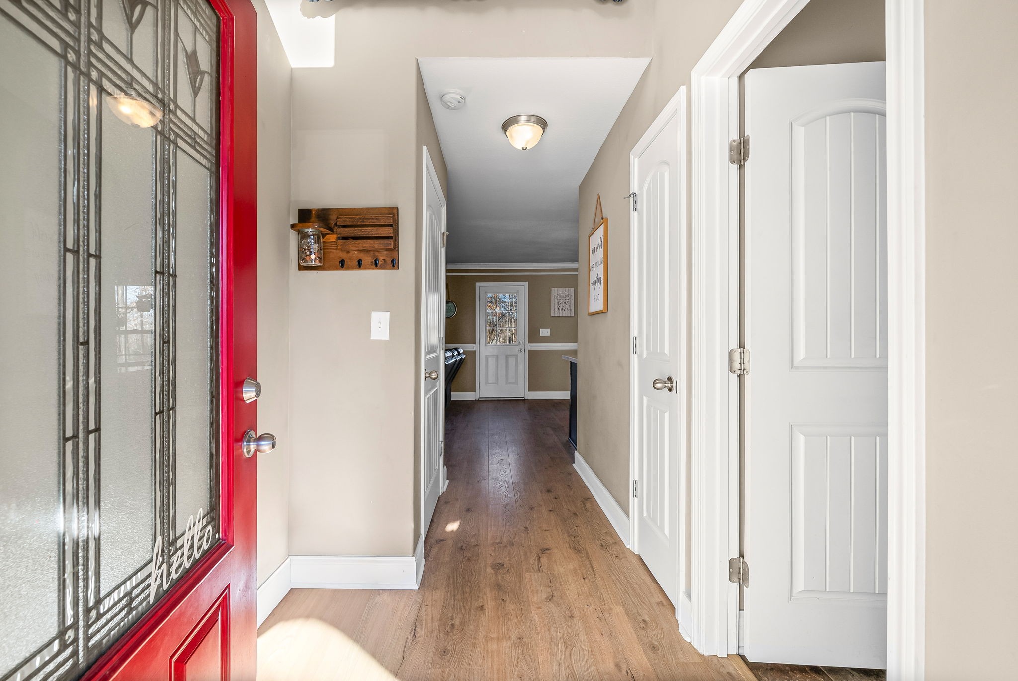 548 Medallion Circle Clarksville, TN 37042 - Photo 7 of 40 a view of a hallway with wooden floor and staircase