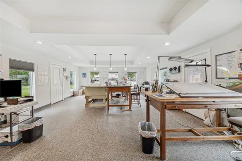 a view of a porch with wooden floor and fence