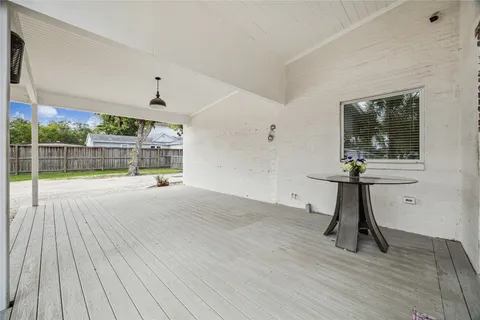 a view of a house with a patio and a yard
