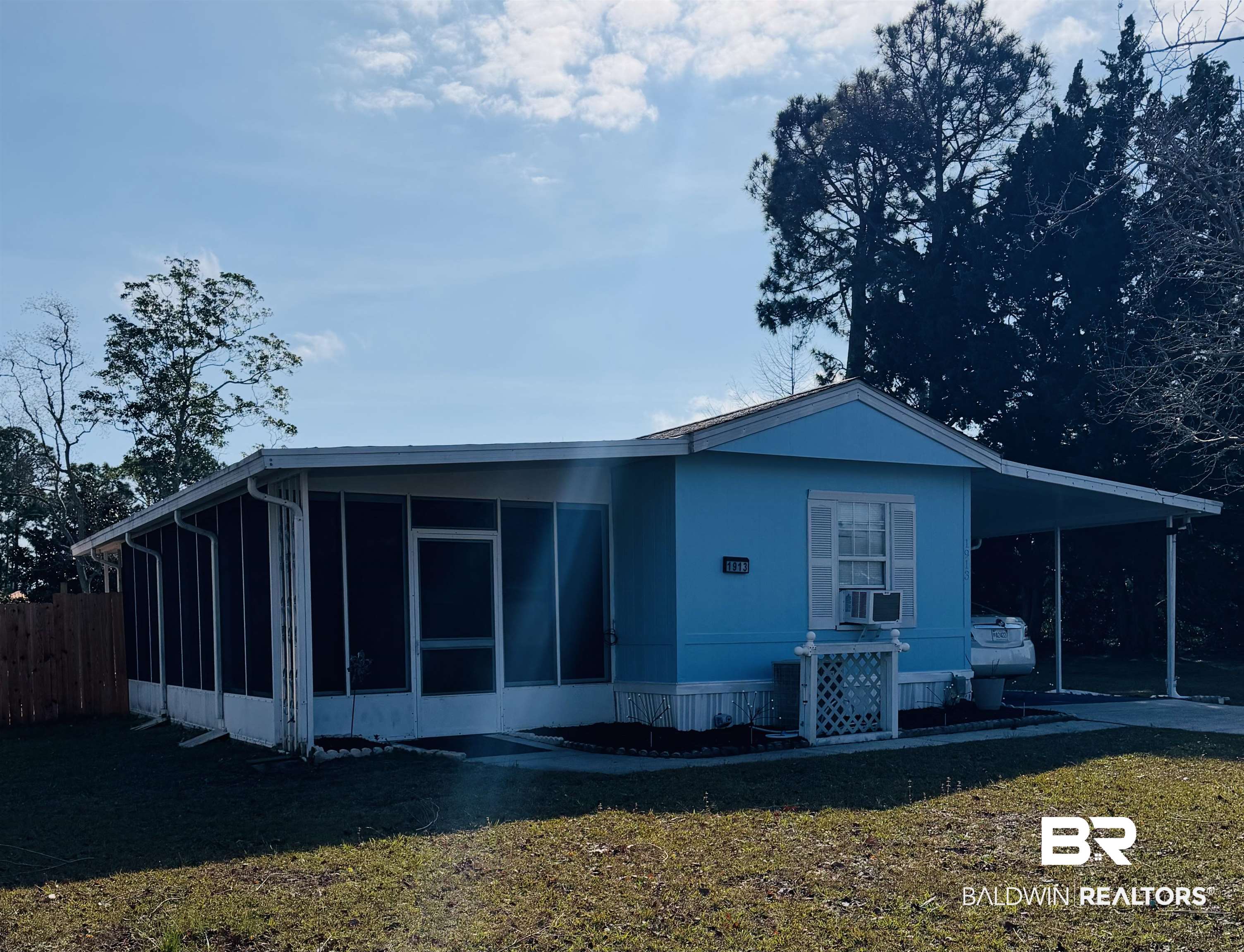 1913 Maria Lane Lillian, AL 36549 - Photo 2 of 35 View of front of home with an attached carport and a sunroom