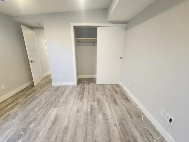 a view of wooden floor in an empty room
