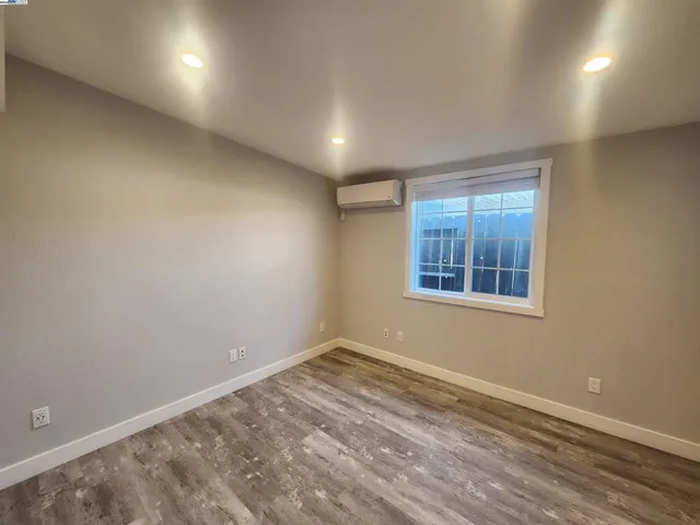 an empty room with a empty space and windows