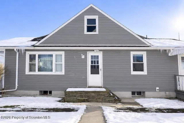 a front view of a house with windows