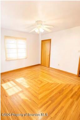 1125 Watson Street Scranton, PA 18504 - Photo 5 of 20 a view of empty room with wooden floor and fan