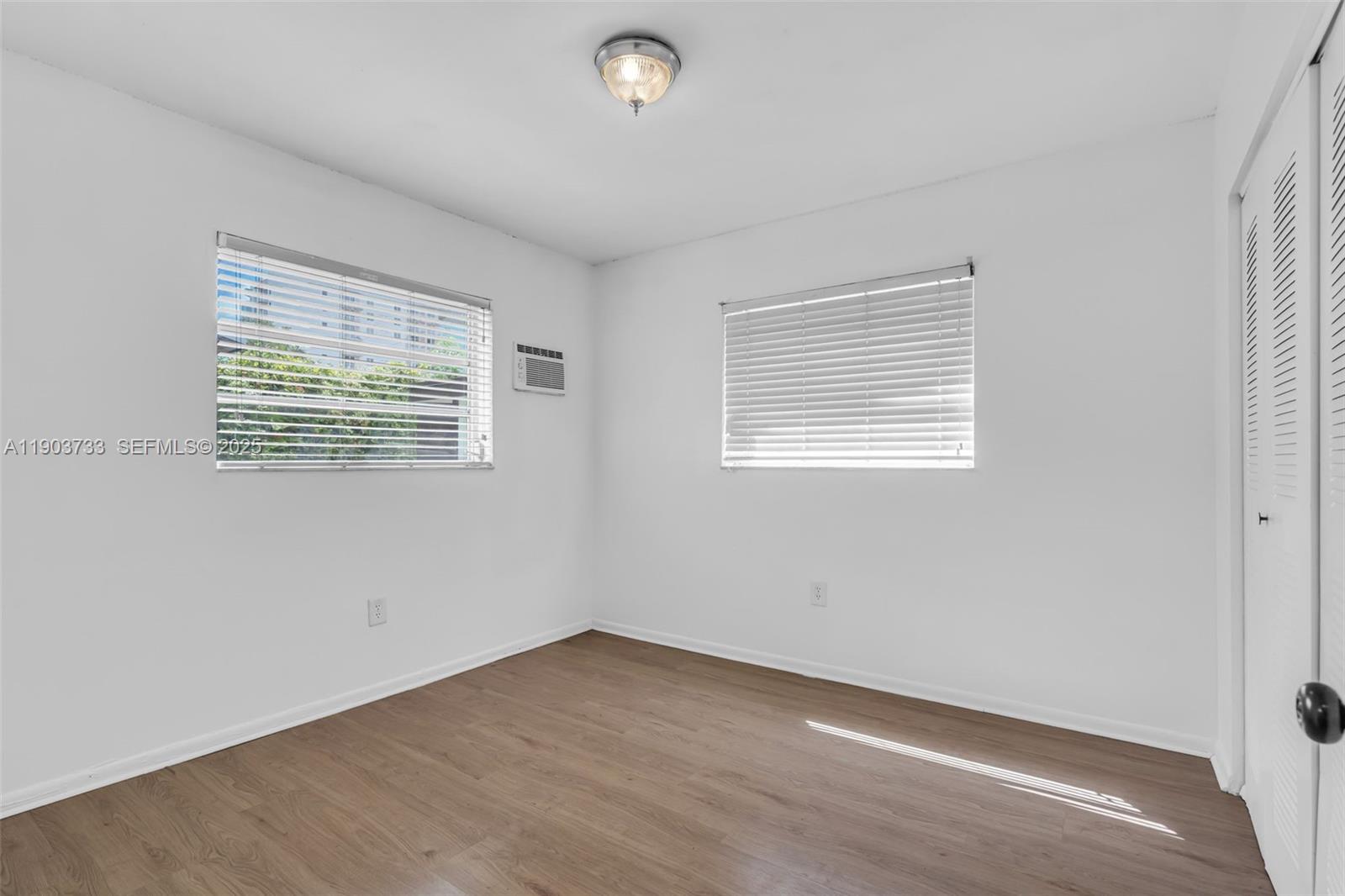 2809 Southwest 23rd Terrace, Unit 2807 Miami, FL 33145 - Photo 8 of 13 an empty room with a window