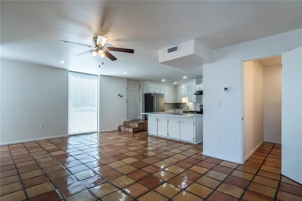 a view of kitchen with stainless steel appliances cabinets and a counter top space