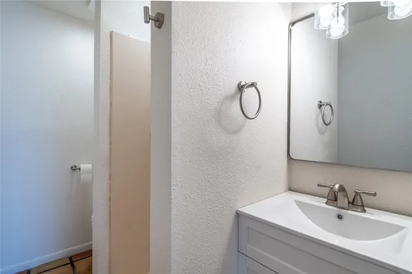 a bathroom with a sink and mirror