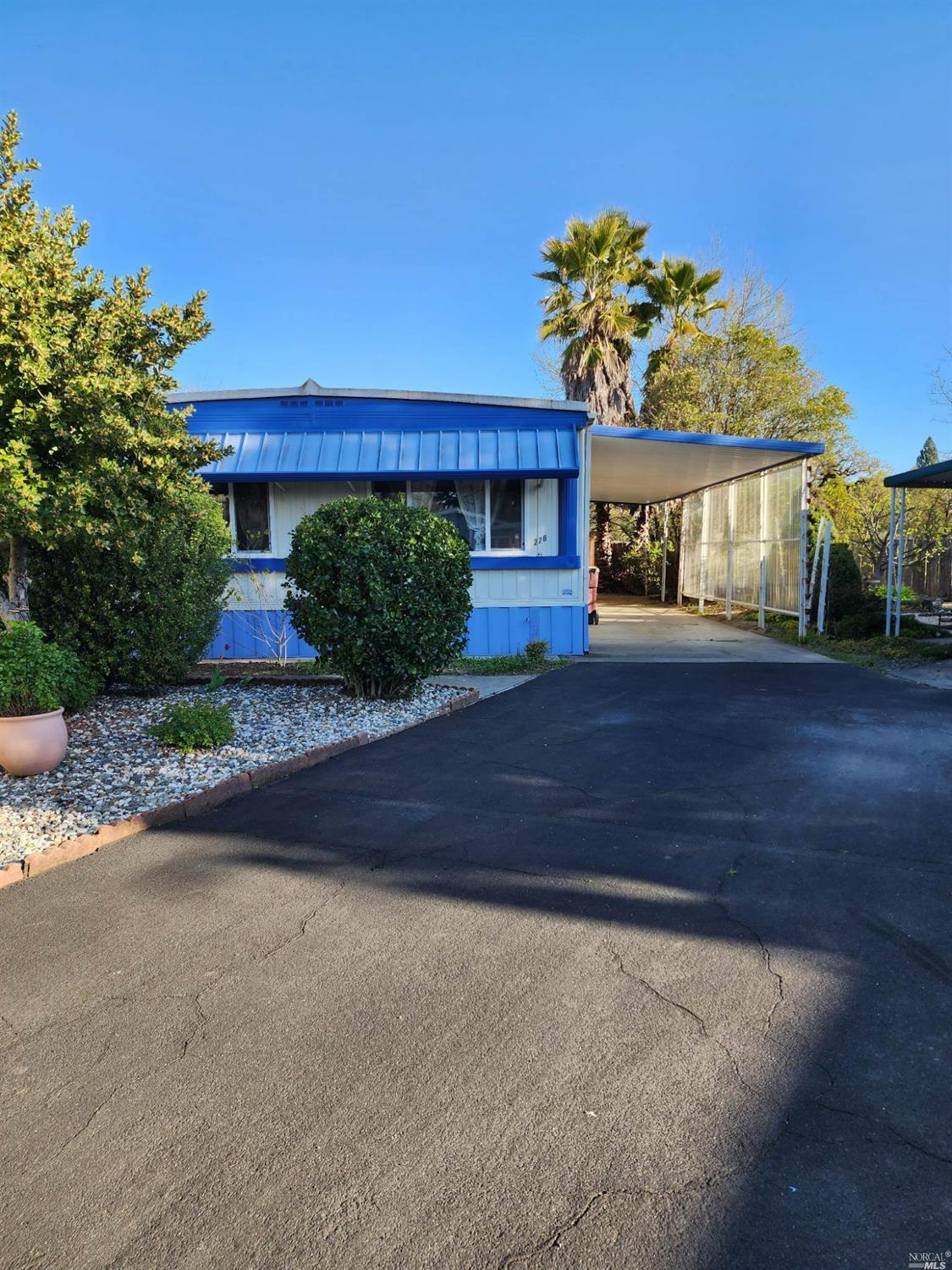a front view of a house with a yard and a garage