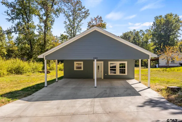 a front view of a house with yard