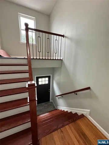 a view of entryway with wooden floor