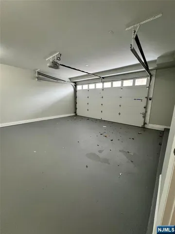 a front view of a house with garage