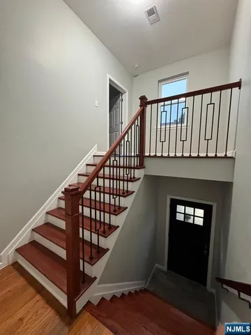 a view of entryway with wooden floor
