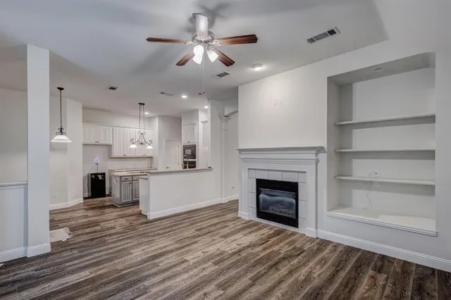 a view of a kitchen with a stove cabinets and wooden floor