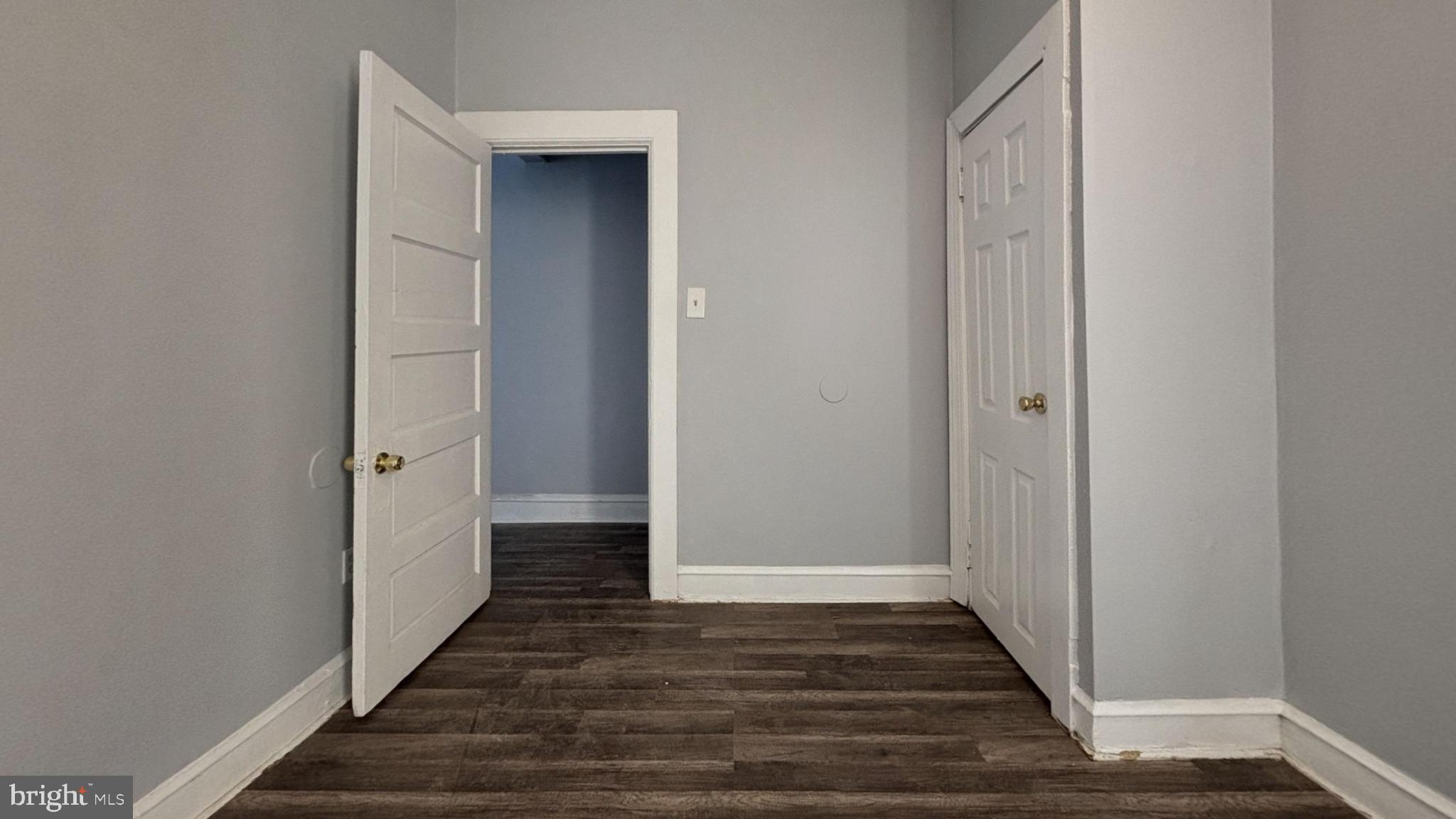 1908 South 65th Street Philadelphia, PA 19142 - Photo 3 of 6 a view of a hallway with wooden floor and staircase
