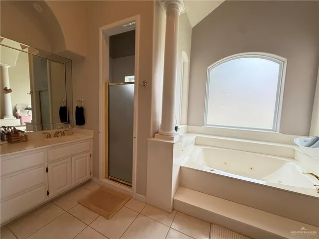 a bathroom with a bathtub and a sink