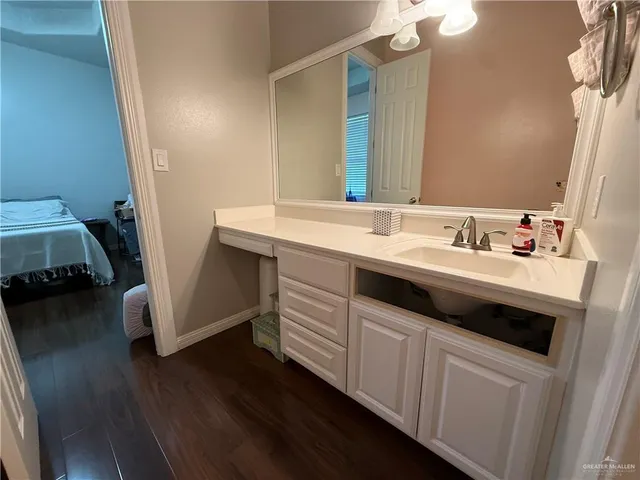 a bathroom with a sink and a mirror
