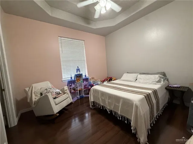 a bedroom with bed and a window