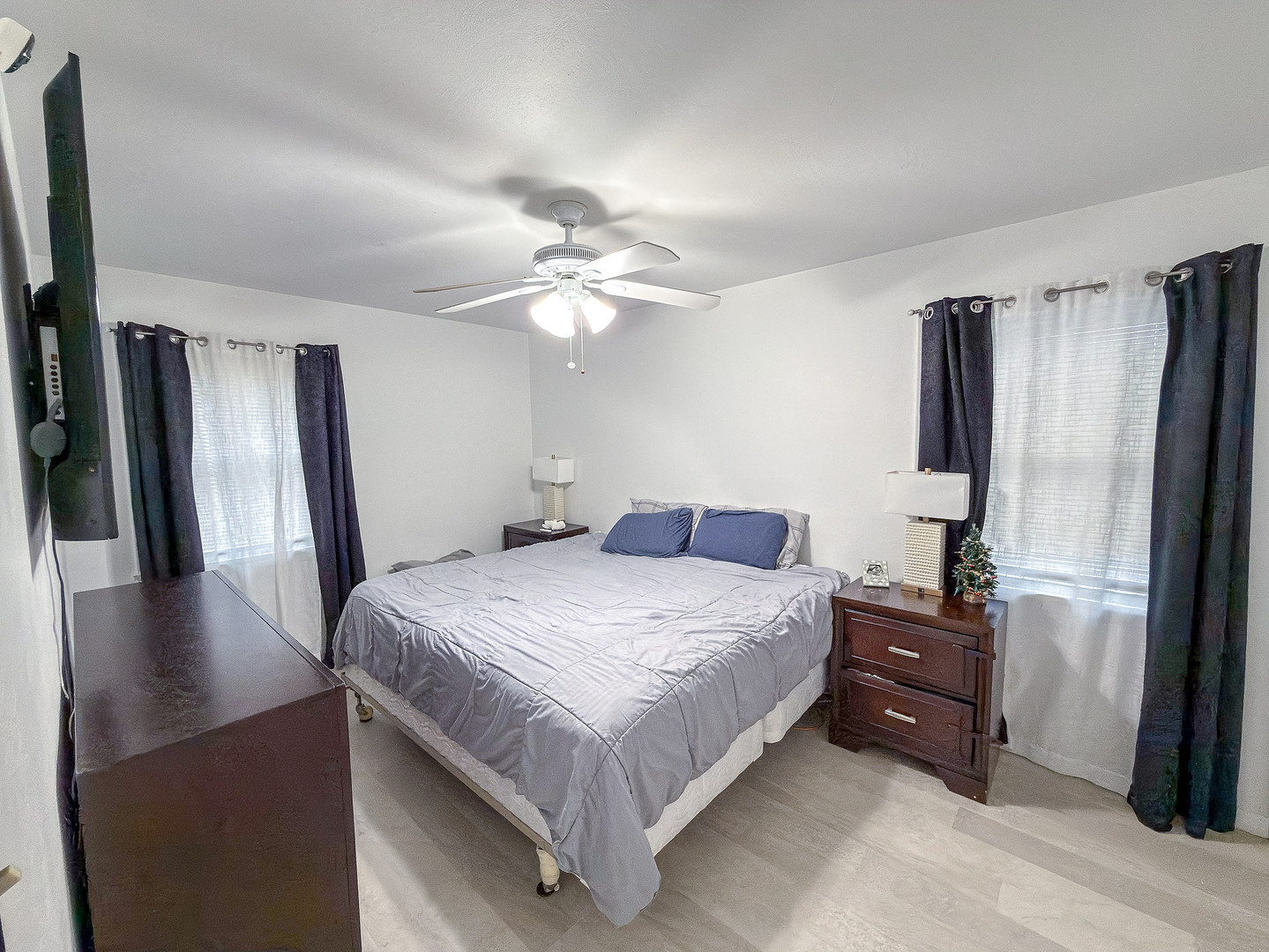 1709 West William Street Champaign, IL 61821 - Photo 13 of 20 a bedroom with a bed dresser and a large mirror