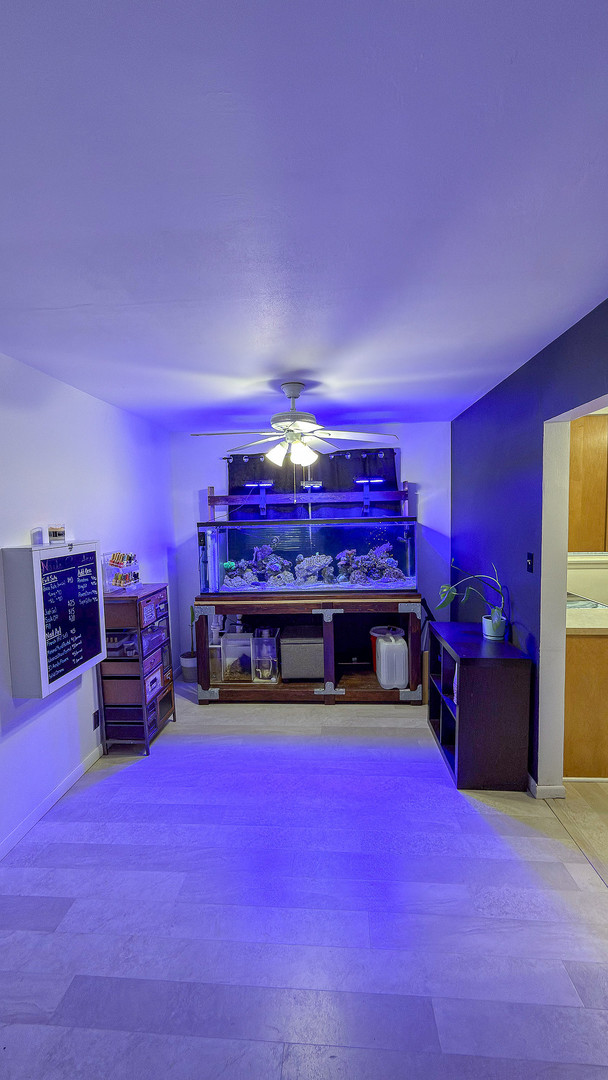 1709 West William Street Champaign, IL 61821 - Photo 8 of 20 a bed room with a bed and a gym equipment