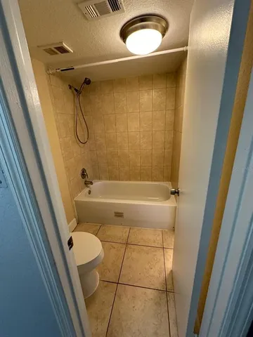 a view of a hallway with a window and a livingroom