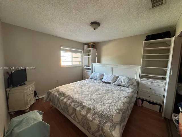 a bedroom with a bed and furniture