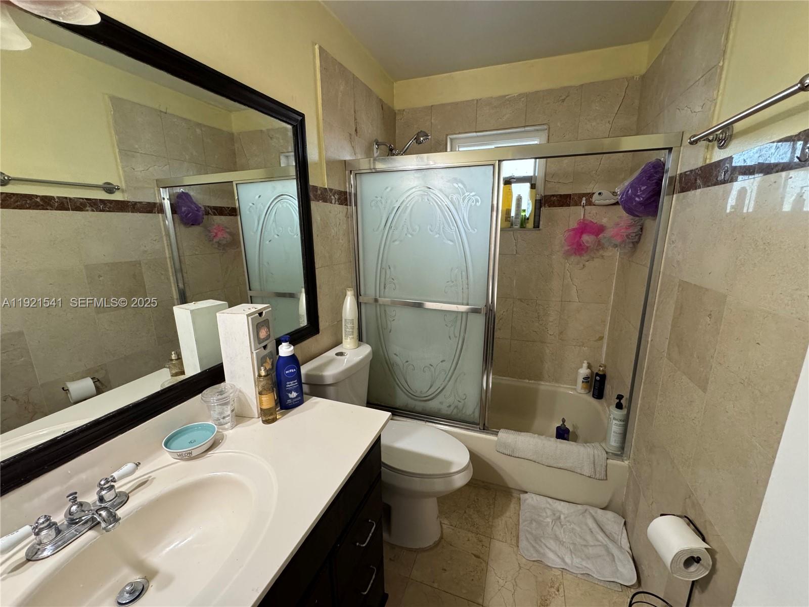 550 Southwest 115th Avenue, Unit 306F Sweetwater, FL 33174 - Photo 13 of 16 a bathroom with a sink toilet and shower