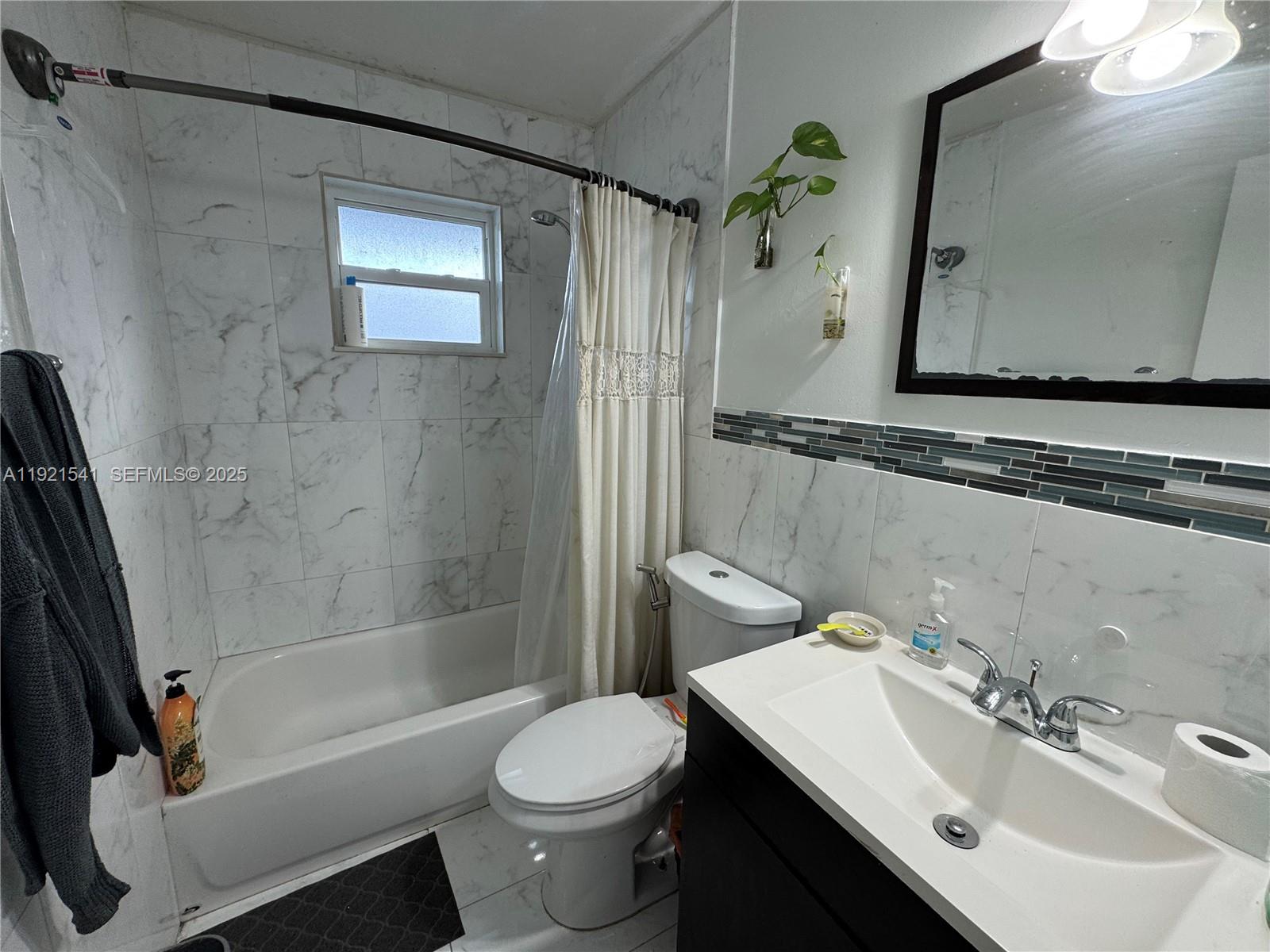 550 Southwest 115th Avenue, Unit 306F Sweetwater, FL 33174 - Photo 15 of 16 a bathroom with a sink toilet and shower