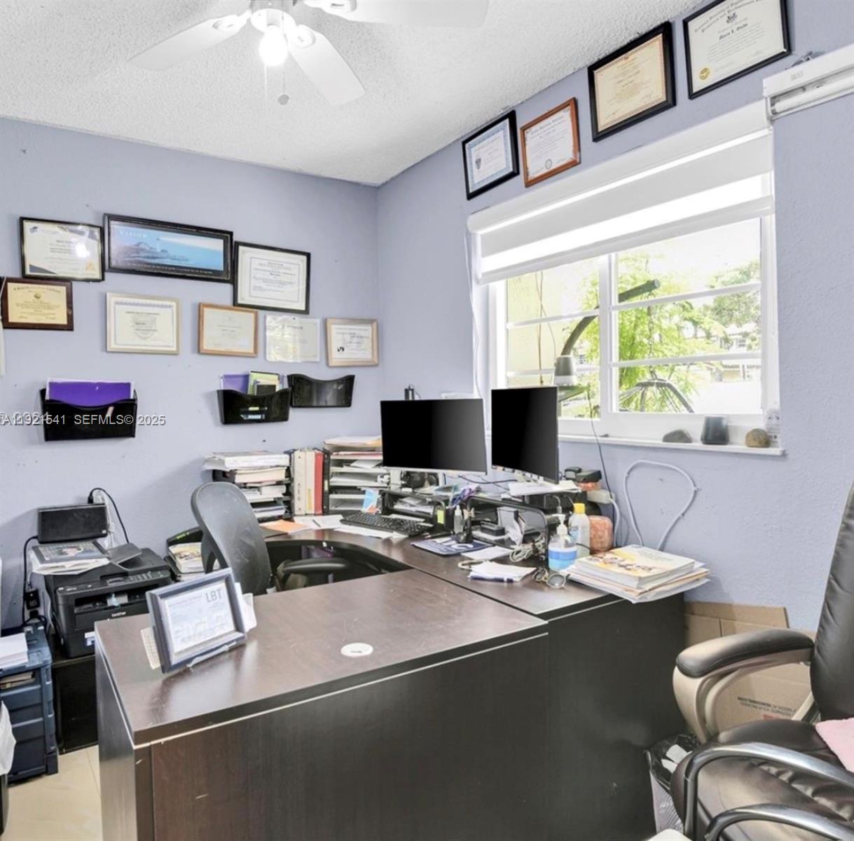 550 Southwest 115th Avenue, Unit 306F Sweetwater, FL 33174 - Photo 6 of 16 a view of a workspace with furniture and a window